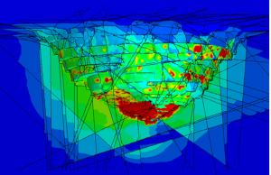 Cut-away section through an open pit showing modelled displacement magnitudes. This model included many faults as shown, as well as pore water pressure effects. The controlling influence of structure is clear, and correlates well with the magnitude and location of movements measured in the pit.